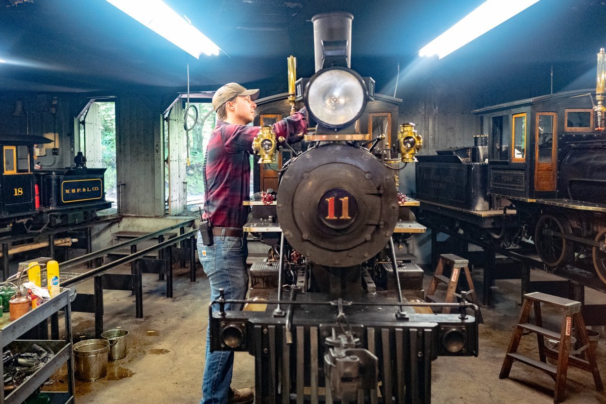 A staff member maintains a locomotive at the Redwood Valley Railroad, a functioning small gauge steam train in Tilden Regional Park, Orinda, California, July 18, 2021.